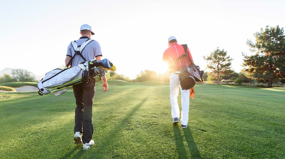 Golfers walking out on the golf course after shopping at Golf Direct Now